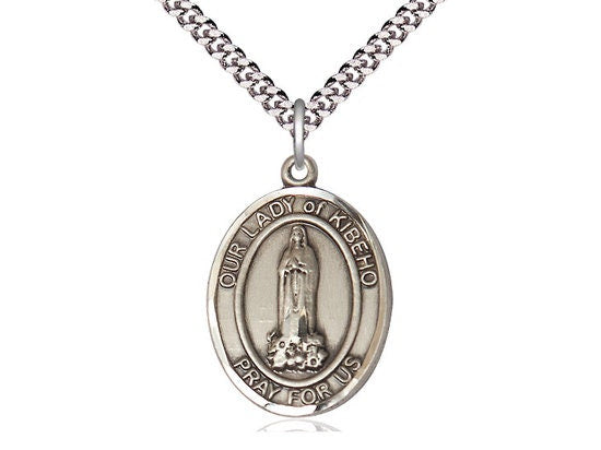 Our Lady of Kibeho Sterling Silver Pendant on a 24 inch Light Rhodium Heavy Curb Chain.