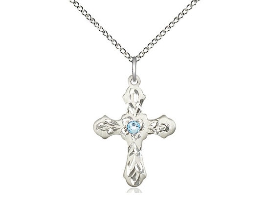 Sterling Silver Cross Pendant with a 3mm Aqua Swarovski stone on a 18 inch Sterling Silver Light Curb Chain.
