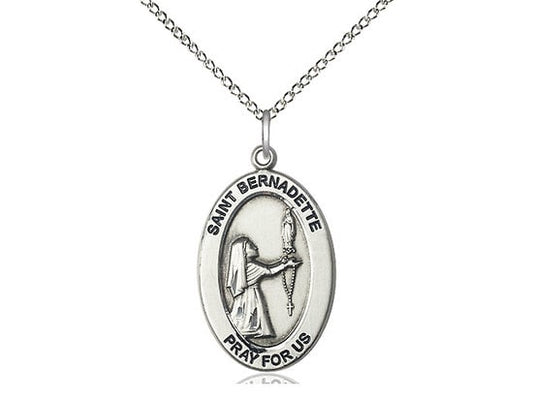 St. Bernadette Sterling Silver Pendant on a 18 inch Sterling Silver Light Curb Chain.